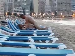 Amateur couple unashamedly fuck on a beach sunlounge